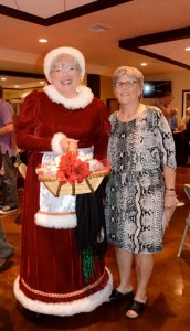 Mattie Williams director Janet Hooper poses with Mrs. Claus. Credit: Janet Hooper