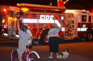 Briar Creek residents wave at Santa riding a SHFD fire truck Friday night.