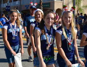 Members of the Safety Harbor Stone Crabs softball team march in the city's 2013 holiday parade.