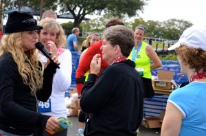 Mindy Crawford is greeted by best Damn Race emcee Suzanne Henslee after she completed the 5k.