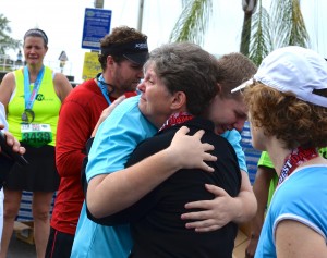 Mindy Crawford and her son, Cuinn, embrace after finishing the BDR 5k.