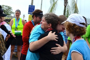 Mindy Crawford and her son, Cuinn, embrace after finishing the Best Damn Race 5k on Saturday, Feb. 1.