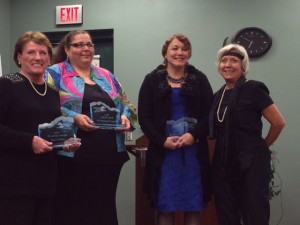 2013 Treasures of the Harbor winners (l-r) Pam Corbino, Virginia Papadolopils and Laura Kepner pose with Nadine Nickeson.