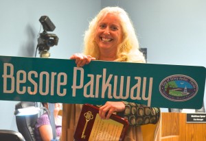 Nancy Besore received this street sign in honor of her five years of service.