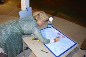 Janet Lee Stinson signs the memory board for Keyana Linbo.