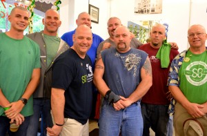 A group of shavees pose at the Chop Shop St. Baldrick's fundraiser.