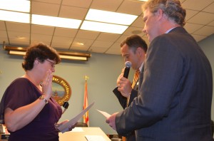 New commissioners Carlos Diaz and Andy Zodrow (R) were sworn in Monday night.