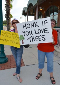 Betty Lou Douglas (R) protests the tree removal at the Safety Harbor Spa on Thursday.