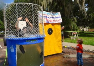 Commissioner Carlos Diaz gets dunked at Harbor Sounds.