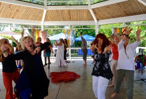 Janet Leigh Stinson (l) leads participants on a journey dance during Healing on the Harbor on Saturday.