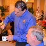 Oldsmar Mayor Doug Bevis serves coffee at the 2013 Mayor's Breakfast event.