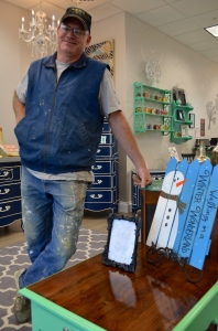 Local artists Guy Duquet uses his creative touch on the furniture at Boutique 238.
