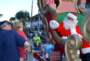 Santa waves to a young boy during the 2013 Safety Harbor Holiday Parade.