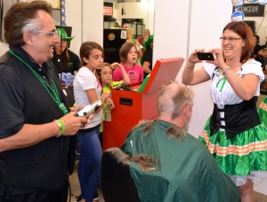 Tony Comeiro enjoys a laugh with Chop Shop coworker Tiana Stebbins at the salon's 2014 St. Baldricks Foundation fundraiser in March.