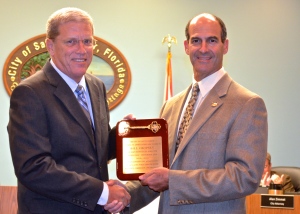 Mayor Andy Steingold presents a plaque to longtime city employee Bill Cropsey (l) on Monday, Sept. 15, 2014.