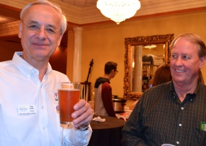 Safety Harbor Chamber of Commerce chairman Paul Peiffer samples some of Odet's Brew. 