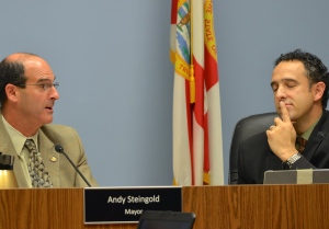 Mayor Andy Steingold and Commissioner Carlos Diaz discuss the arborist issue Monday night.