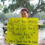 Laura Dent holding her "save the trees" sign on Bayshore Boulevard in 2014. Credit: Dave Hutchinson