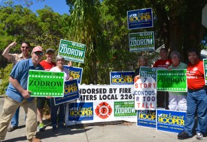 Andy Zodrow and Janet Hooper (front left) stand with their supprters outside the Safety Harbor Public Library on Election Day 2015.