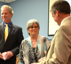 Andy Zodrow, Janet Hooper and Cliff Merz congratulate each other after being sworn in on Monday night.