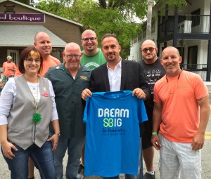 Chop Shop officials pose with members of the St. Baldrick's Foundation after the fundraiser at the salon on Saturday.