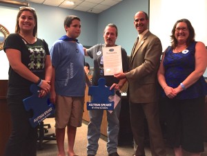 Safety Harbor Mayor Andy Steingold presents a proclamation to local autism awareness advocates.