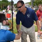 Safety Harbor Mayor Andy Steingold greets SPC Riney.