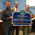 Crooked Thumb Brewery co-founders Kip Kelly (l) and Travis Kruger (r) pose with Safety Harbor Mayor Andy Steingold after receiving the 2016 Mayors Award of Excellence in January.