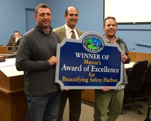 Crooked Thumb Brewery co-founders Kip Kelly (l) and Travis Kruger (R) pose with Safety Harbor Mayor Andy Steingold on Monday night.