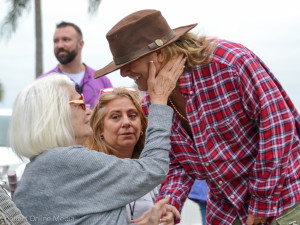 Robin Zander gets a tearful hug from his mother-in-law during the 2016 Safety Harbor Songfest on Saturday night.
