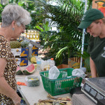 Kara Kilpatrick of Kilpatrick Produce rings up a customer on Sunday.