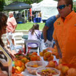 Dempsey lee of Florida Citrus Country talks to a shopper at Safety Harbor's Farmer's Market ion Main last Sunday.