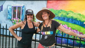 Heather Richardson (R) and Beth Warmath pose in front of their latest mural in downtown Safety Harbor.