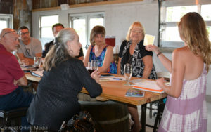 Mercedes Ofalt (l) leads a discussion at the latest MOSH board meeting at Crooked Thumb Brewery on Monday.