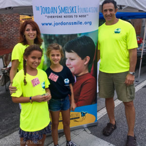 Safety Harbor City Commissioner Carlos Diaz, his wife, Lori and their daughter, Isabella, campaign on behalf of the Jordan Smelski Foundation with a family friend last Third Friday.