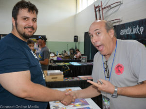 George Lowe, a.k.a. Space Ghost (r) poses with a fan during FusionCon 3 at the Safety Harbor Community Center on Saturday, April 29, 2017.